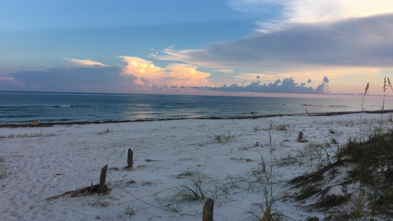 A view of the beach during sunset.